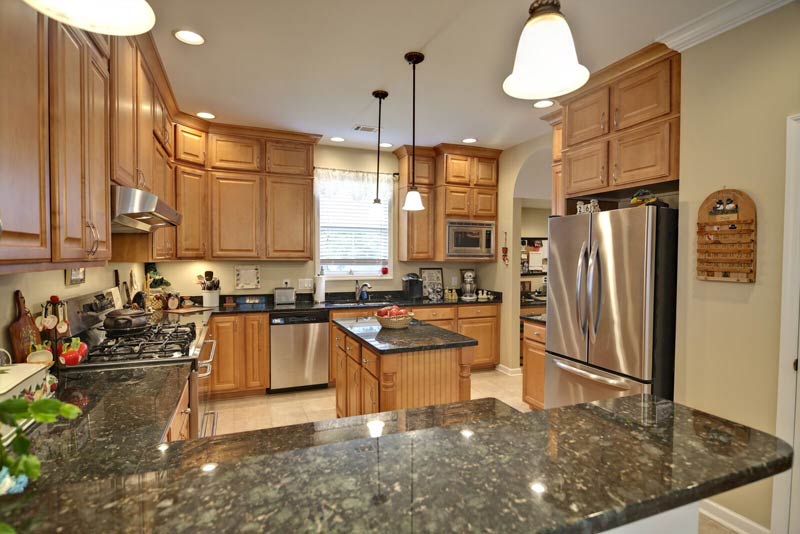 Granite Countertops green maple cabinets Northern Michigan MKD Kitchens